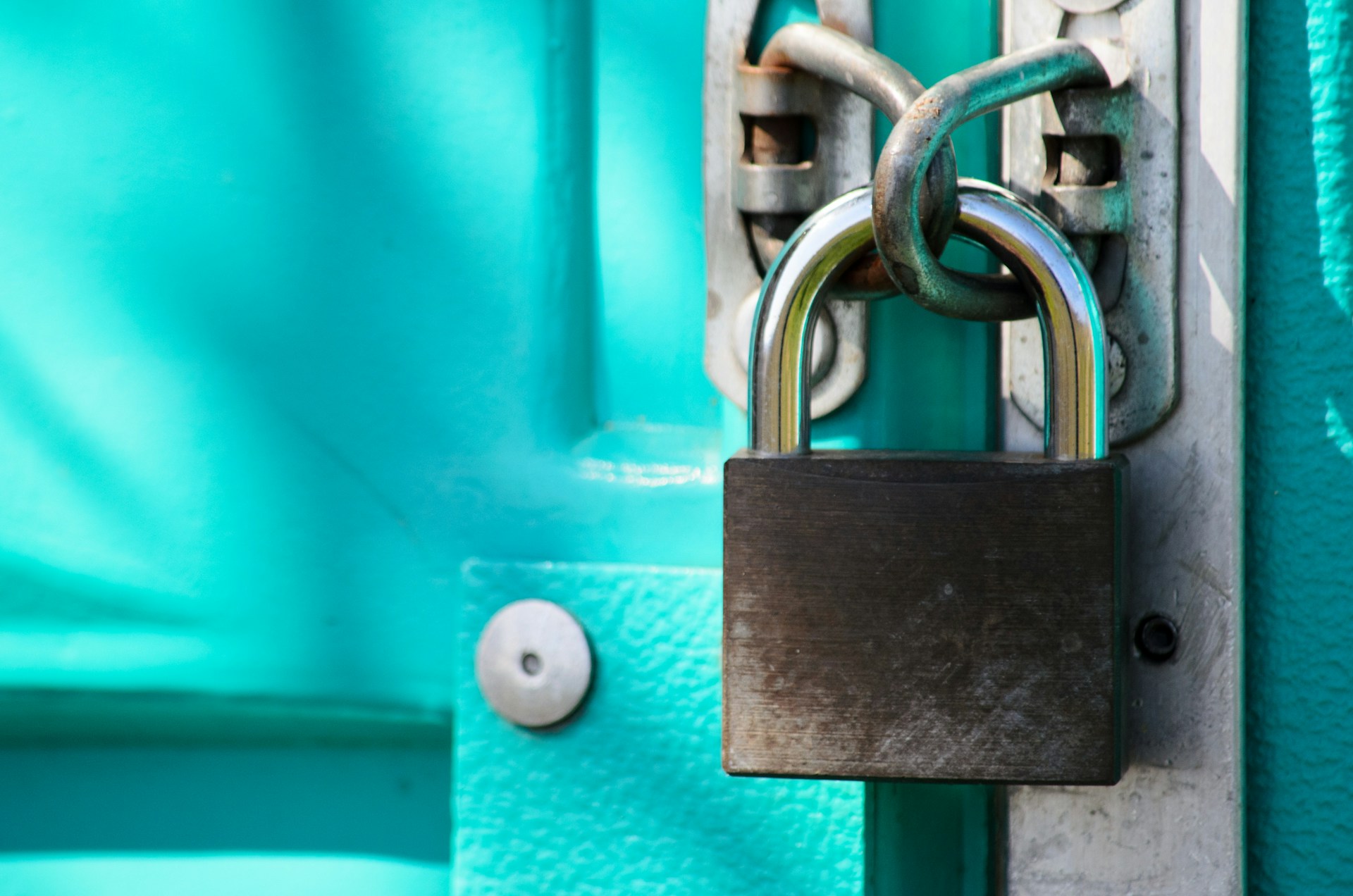 A padlock on a blue door