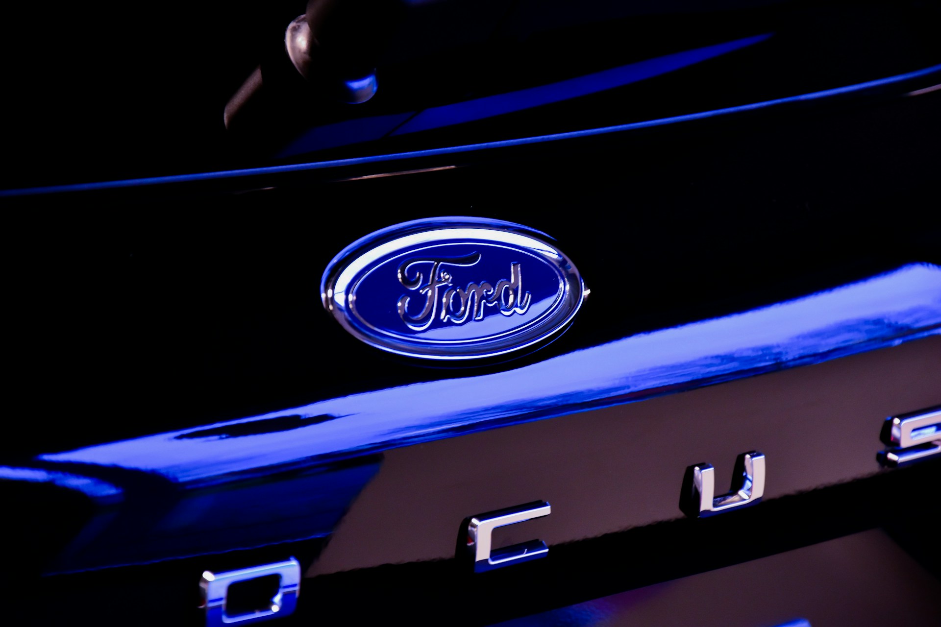 The Ford logo on the front of a Focus