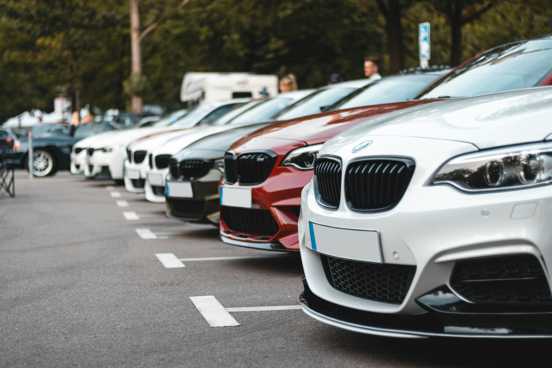 A line of cars in a car park during the day