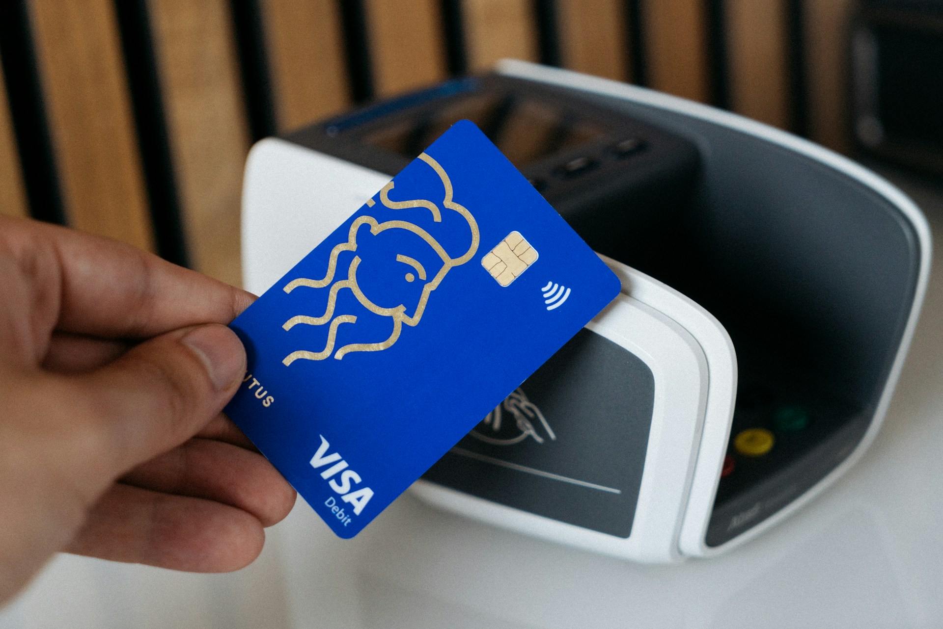 A Visa card being used on a contactless terminal