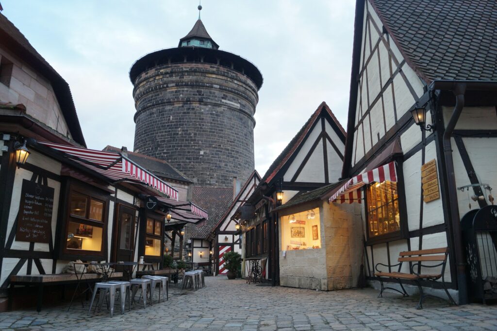 A castle turret and market street in Nuremberg