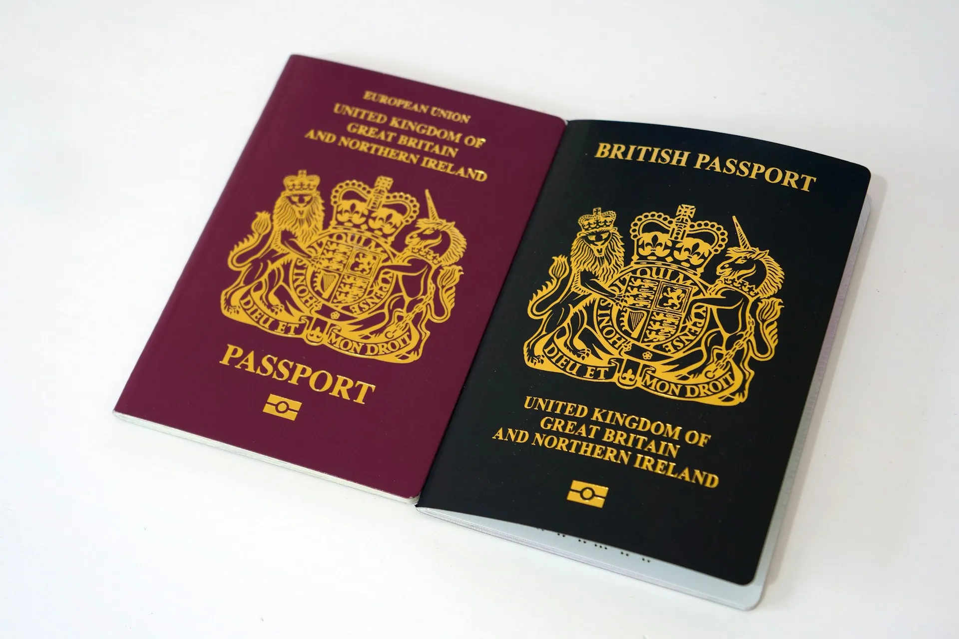 A red and blue passport side by side