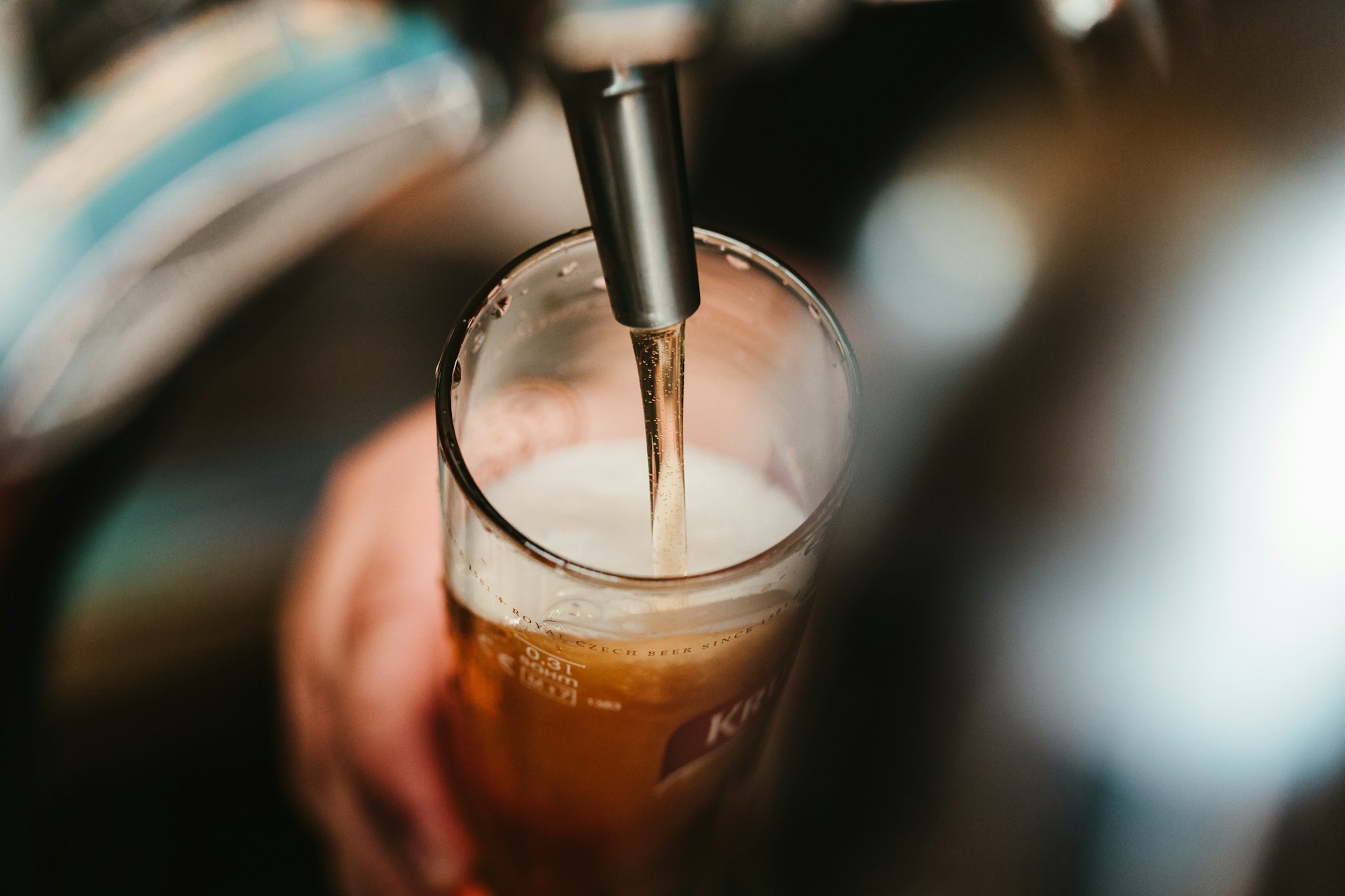 A pint of beer being poured