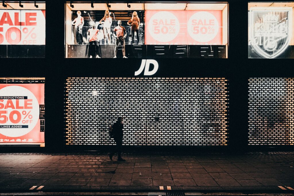A JD Sports shop front at nighttime