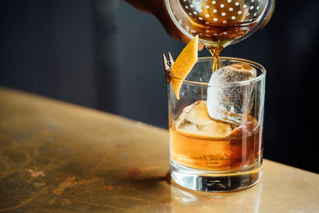 A cocktail being poured